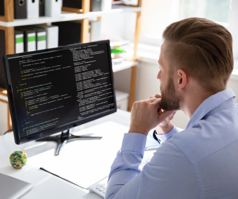 man doing coding on computer